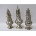 3 SILVER SUGAR CASTORS with pierced tops, baluster bodies with floral decoration in stemmed circular