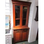 EDWARDIAN WALNUT BOOKCASE, glazed twin door above twin frieze drawers and double cupboard base, 88cm