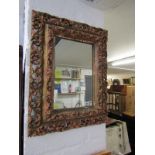 ANTIQUE DESIGN MIRROR, ornate gilt framed foliate surround mirror, 66cm x 52cm