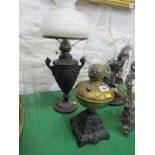 OIL LAMPS, Edwardian ornate cast iron base brass reservoir oil lamp; together with 1 other cast
