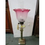 ANTIQUE OIL LAMP, brass column base oil lamp with cut glass reservoir and frosted cranberry shade