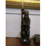 EASTERN CARVING, 19th Century carved cherry root Sage figure lamp base, 56cm height