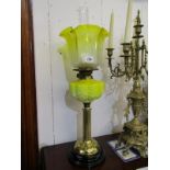 ART NOUVEAU OIL LAMP, an attractive brass column base oil lamp with yellow glass reservoir and