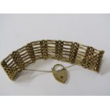 9ct YELLOW GOLD 7 BAR GATE BRACELET, with heart padlock clasp, approx. 46.7 grams