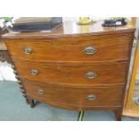 EARLY 19TH CENTURY BOW FRONTED CHEST, cross banded with triple graduated drawers & splayed bracket