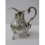 MID VICTORIAN SILVER MILK JUG, floral and scroll embossed pear shaped milk jug with ornate double