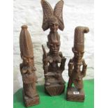 NIGERIAN CARVINGS, 3 carved wooden ceremonial figures signed Gani Fakeye, height 54cm's