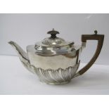 SILVER OVAL TEAPOT, spiral fluted base teapot with carved fruitwood handle and finial, London