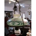 BRASS FRAMED OIL LAMP with an art nouveau floral painted milk glass oil lamp shade, 37cm dia,