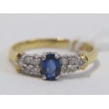 18ct YELLOW GOLD SAPPHIRE & DIAMOND RING, principal oval cut royal blue sapphire with 5 brilliant