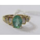 10ct YELLOW GOLD EMERALD & DIAMOND RING, principal oval cut emerald with baguette cut diamonds to