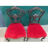 EDWARDIAN SALON CHAIRS, pair of carved back red velvet upholstered chairs on slender cabroile legs