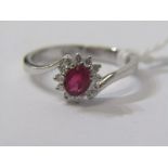 18ct WHITE GOLD RUBY & DIAMOND CLUSTER RING, unusual cross over design, principal oval cut ruby