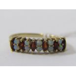 9ct YELLOW GOLD OPAL & GARNET ETERNITY STYLE RING, 5 pairs of opals each separated by a marquise cut