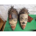 ETHNC, 2 Cameroon painted wood face masks with stylised metalware hair ornaments, 40cm height