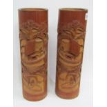 ORIENTAL CARVING, a pair of carved bamboo vases, decorated with riverscapes, 35 cm height