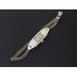 PLATINUM & DIAMOND CASED COCKTAIL WATCH on 9ct white gold bracelet, mechanism in untested condition