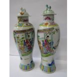 ORIENTAL CERAMICS, pair of famille rose, lidded inverted baluster vases, decorated with panoramic