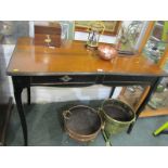 ROCHE BOIS, twin drawer ebonised base desk on splayed legs with metal mounts, 110cm width