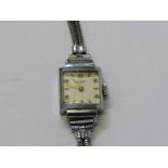 LADIES WHITE METAL CASED WRIST WATCH BY UNIVERSAL, untested condition