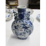 ORIENTAL CERAMICS, underglaze blue twin handled moon flask, decorated with market tradesman and