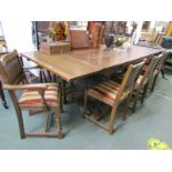 REPRODUCTION OAK DINING SUITE, large draw leaf table and 8 oak linen fold panelled chairs