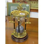 DECORATIVE HOUR GLASS, ornate brass cased "Maritime" hour glass, 26cm height