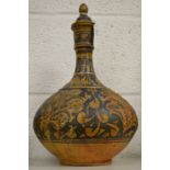An Islamic painted terracotta bottle.