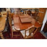 A set of six shield back mahogany dining chairs, one with arms.