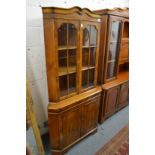 A large yew wood corner cabinet.