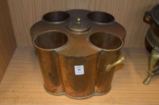 A copper and brass four bottle wine cooler.