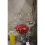 Various champagne glasses to include three with unusual moulded stems.