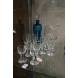 A Holmegaard Kluk Kluk decanter and stopper together with twelve Holmegaard schnapps glasses and a