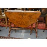 A Victorian figured walnut Sutherland table.