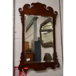 A mahogany fretwork framed wall mirror.