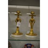 A good pair of Arts & Crafts brass candlesticks on onyx bases.