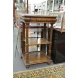 An oak three tier pedestal stand with a single frieze drawer.