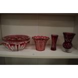 A good ruby tinted cut glass circular bowl and three similar items.