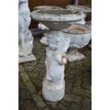 A cherub birdbath.