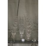 A set of six facet cut conical cut wine glasses together with a set of five similar and five smaller