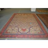 A large early 20th century Persian carpet of unusual design (faults).