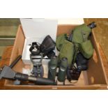 A spotting scope, a pair of Swarovski binoculars and similar equipment.
