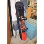 A snow board and travelling case.