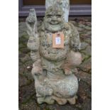A garden ornament modelled as a Buddha.