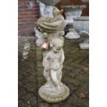 A figural bird bath.