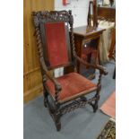 A 18th century walnut framed high back armchair.