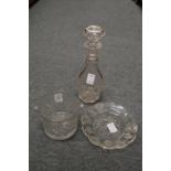 A cut glass wine glass rinser, a decanter engraved with grapes and vine, with similar dish.