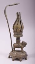 AN UNUSUAL INDIAN BRONZE CANDLESTICK, with reticulated petal formed cup, twisting the petals anti