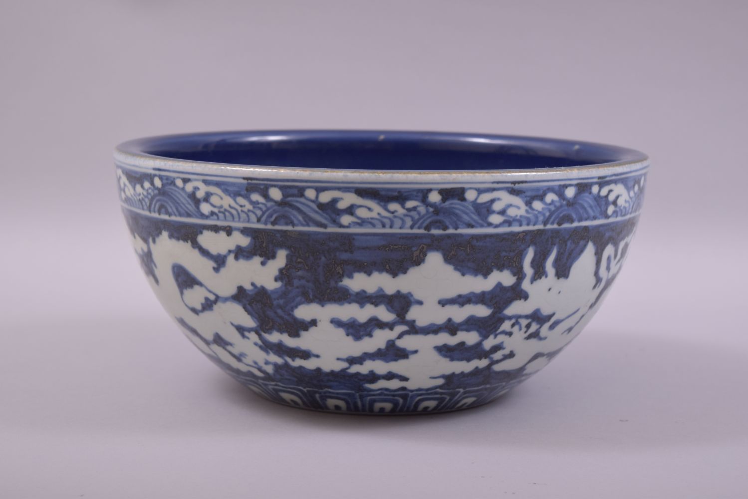 A LARGE CHINESE SACRIFICIAL BLUE GLAZE DRAGON BOWL, the exterior with white dragons and clouds - Image 4 of 7