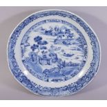 A CHINESE BLUE AND WHITE PORCELAIN DISH, the centre painted with a landscape setting, the foreground